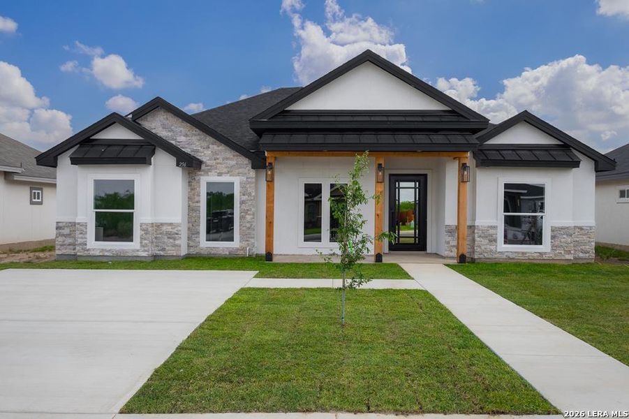 Front exterior of a new home in , Eagle Pass, TX, highlighting curb appeal (Image 2). Front exterior of a new home in , Eagle Pass, TX, highlighting curb appeal (Image 2).