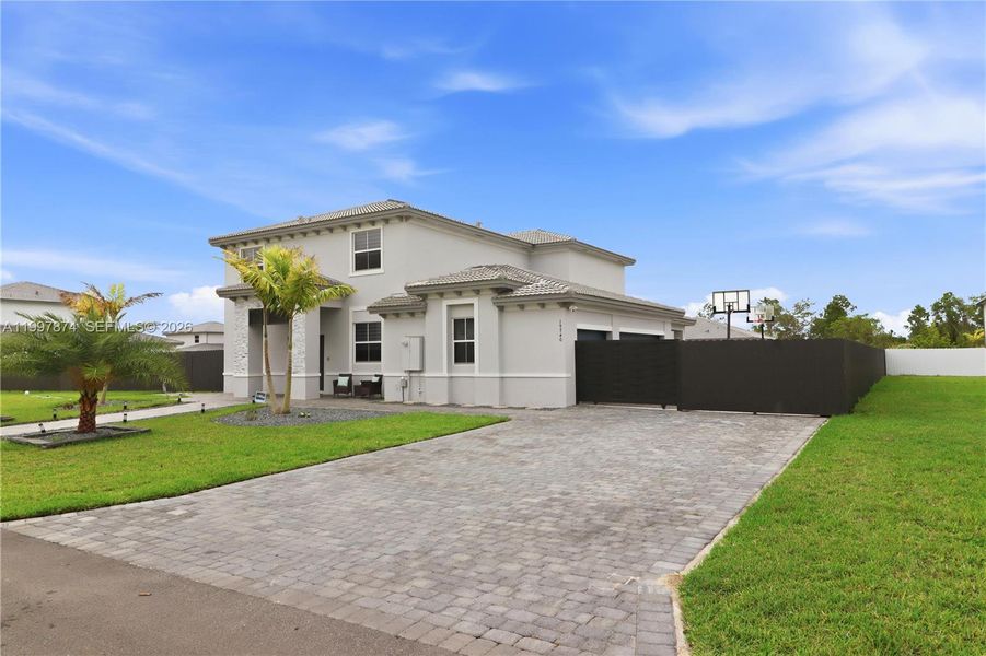 Front exterior of a new home in , Homestead, FL, highlighting curb appeal (Image 23).