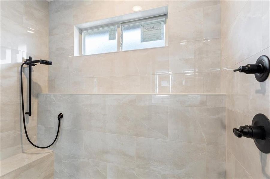 Bathroom with a tile shower Bathroom with a tile shower