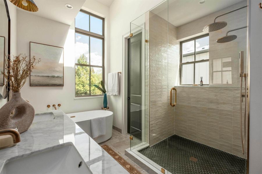 High ceilings and a glass-enclosed shower elevate this light-filled bath. High ceilings and a glass-enclosed shower elevate this light-filled bath.