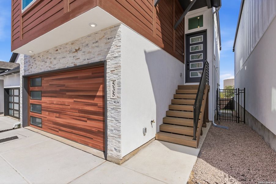 Exterior details and patio area of a home in Centero at Stone Oak, San Antonio (Image 3).