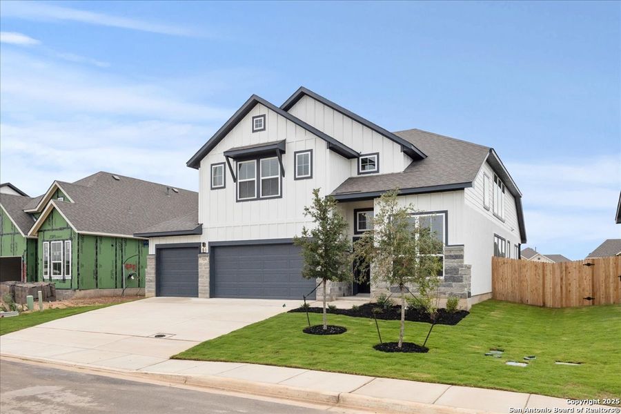 Front exterior of a new home in Village at Three Oaks, Seguin, TX, highlighting curb appeal (Image 1). Front exterior of a new home in Village at Three Oaks, Seguin, TX, highlighting curb appeal (Image 1).