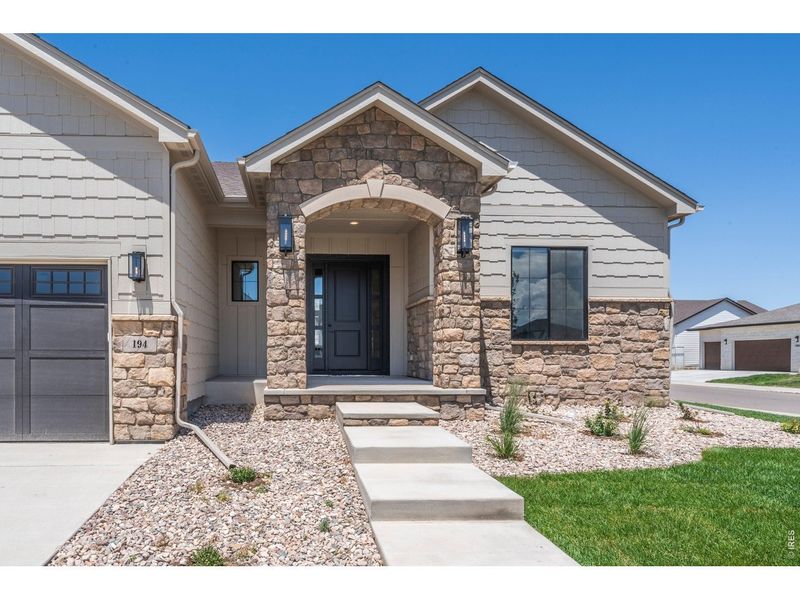 Front exterior of a new home in Greenspire At Windsor Lake, Windsor, CO, highlighting curb appeal (Image 26).