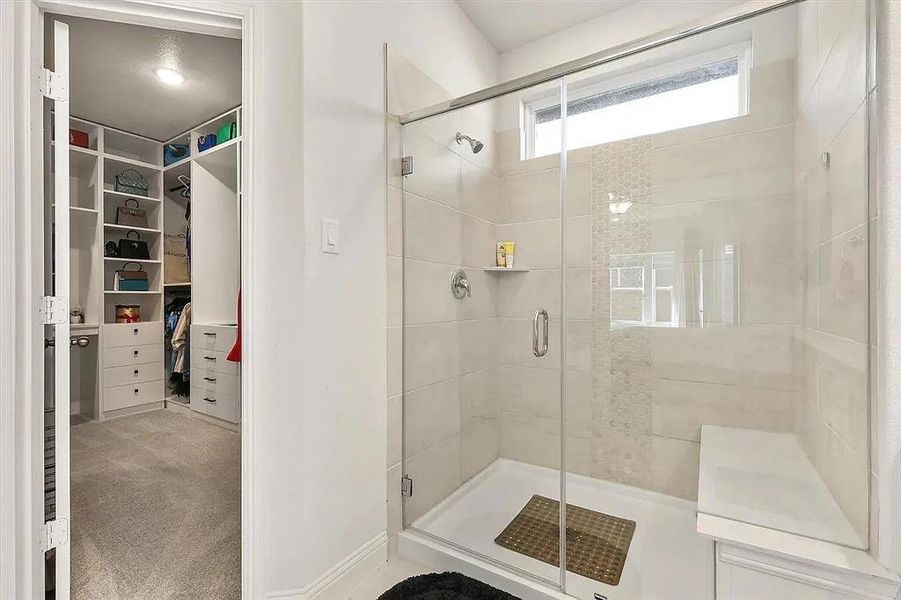 Bathroom with a shower with door