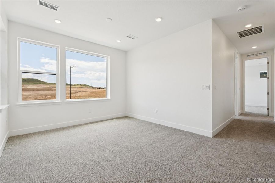 Spacious, unfurnished interior of a new home in Storytellers at Lyric, Lone Tree (Image 40).