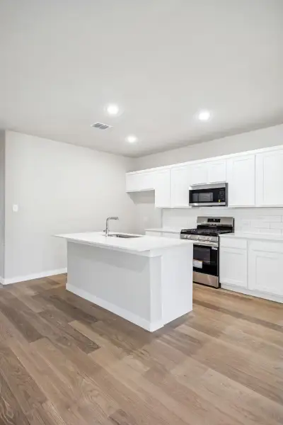Kitchen in the Willow home plan by Trophy Signature Homes – REPRESENTATIVE PHOTO Kitchen in the Willow home plan by Trophy Signature Homes – REPRESENTATIVE PHOTO