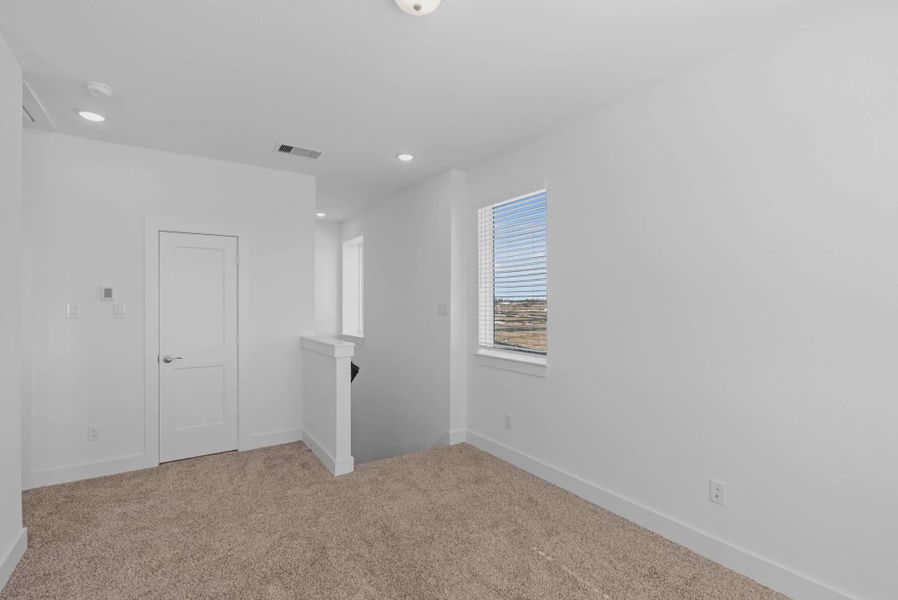 Representative unfurnished interior of a home built from the St Andrews by Chesmar Homes in Riceland Alley Loads, Mont Belvieu (Image 43).