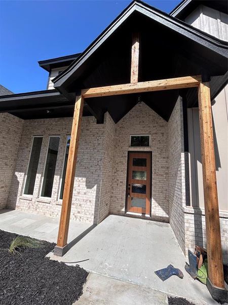 Exterior details and patio area of a home in , Poolville (Image 24).