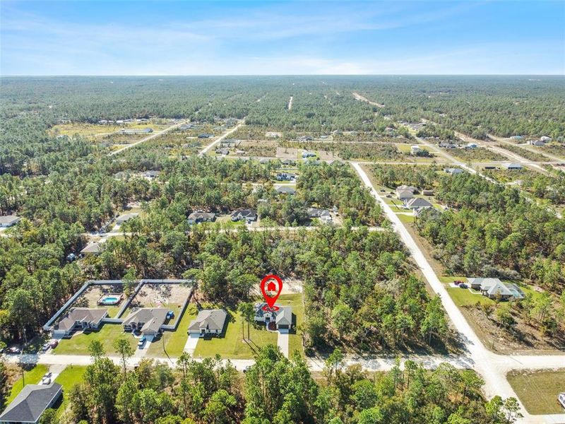 Front exterior of a new home in , Weeki Wachee, FL, highlighting curb appeal (Image 34). Front exterior of a new home in , Weeki Wachee, FL, highlighting curb appeal (Image 34).