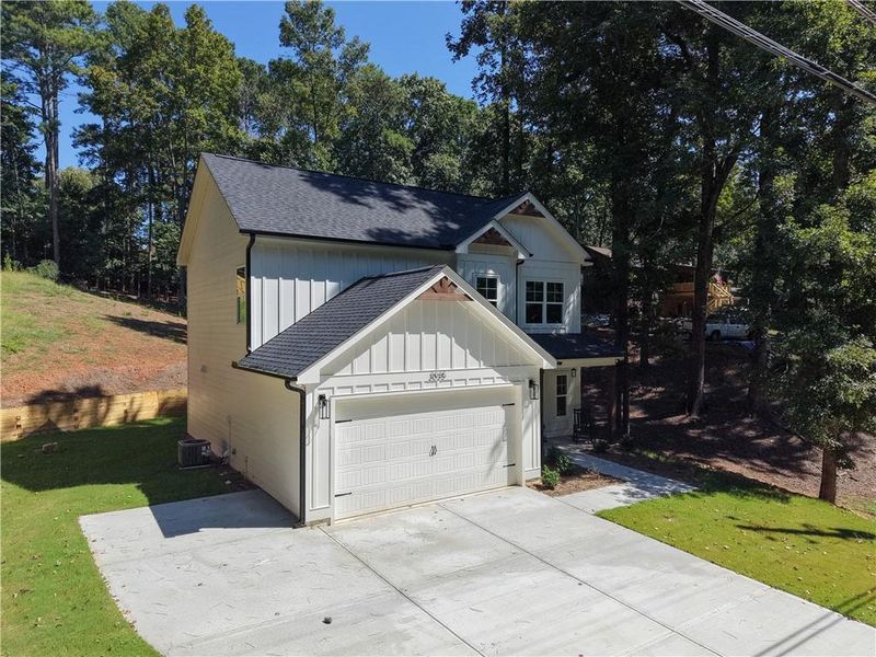 Front exterior of a new home in , Cumming, GA, highlighting curb appeal (Image 1). Front exterior of a new home in , Cumming, GA, highlighting curb appeal (Image 1).