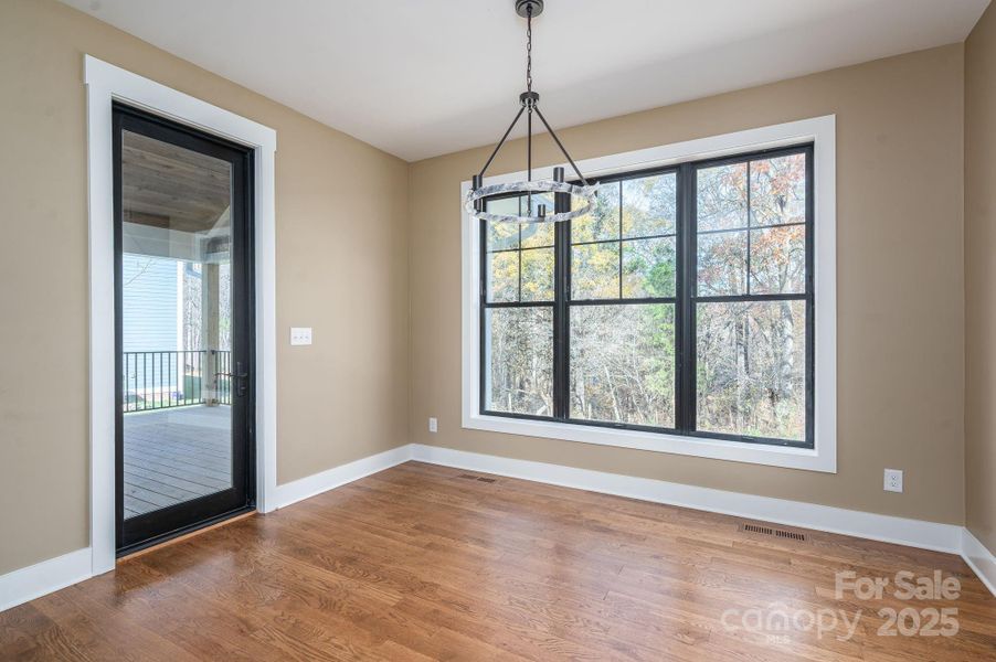 Dining area with large windows.