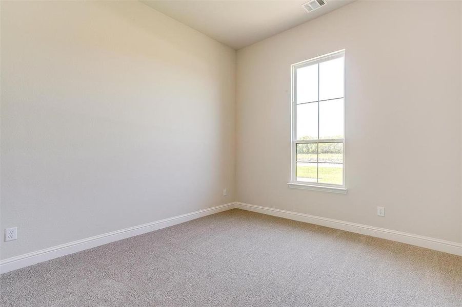 Unfurnished room with carpet flooring