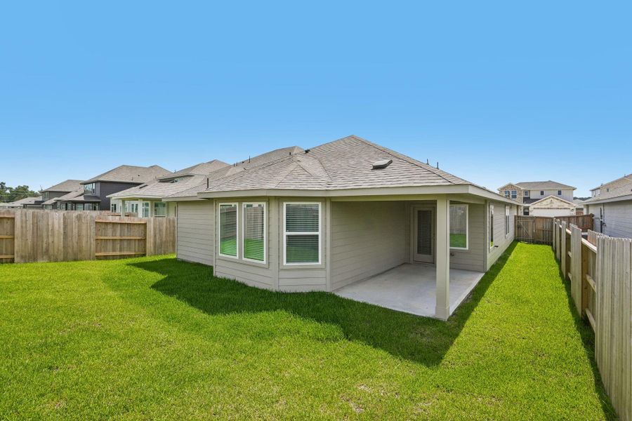 Exterior details and patio area of a home in Riviera Pines - Premier Series, Huffman (Image 21).