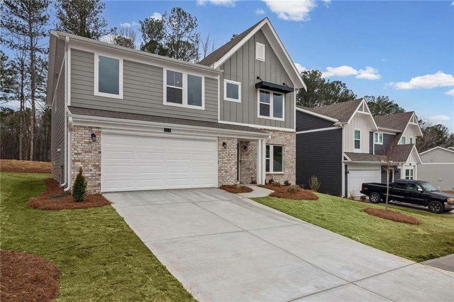 Front exterior of a new home in Sage Woods, Dallas, GA, highlighting curb appeal (Image 21).