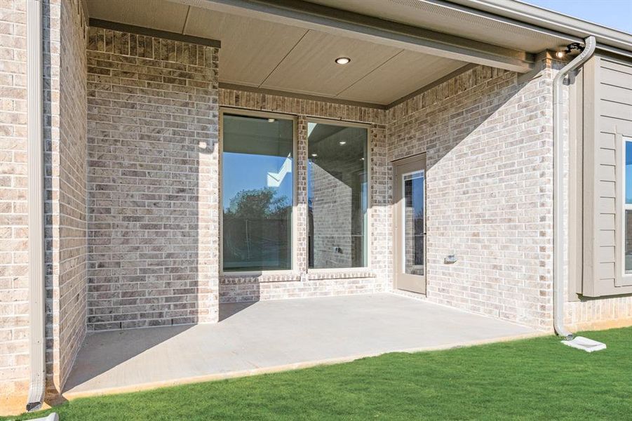 Exterior details and patio area of a home in Mockingbird Hills 60-65, Joshua (Image 4).