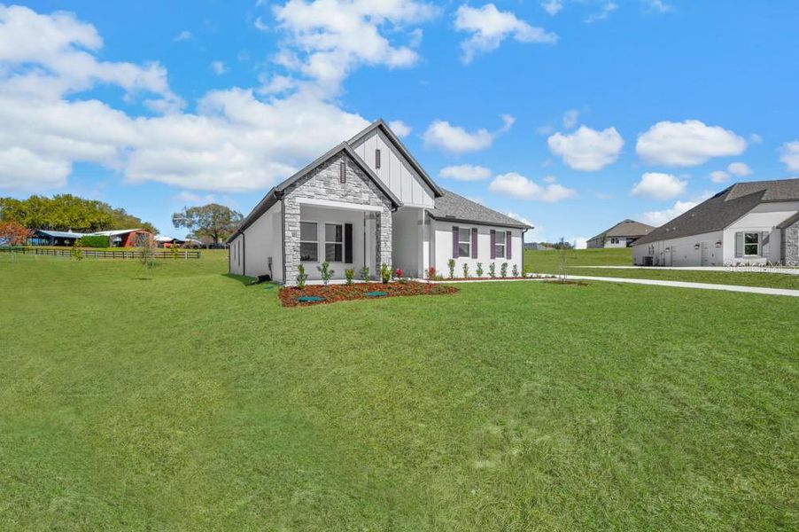 Front exterior of a new home in , Fruitland Park, FL, highlighting curb appeal (Image 2). Front exterior of a new home in , Fruitland Park, FL, highlighting curb appeal (Image 2).