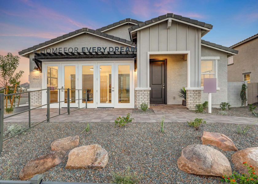 A house with a stone driveway.