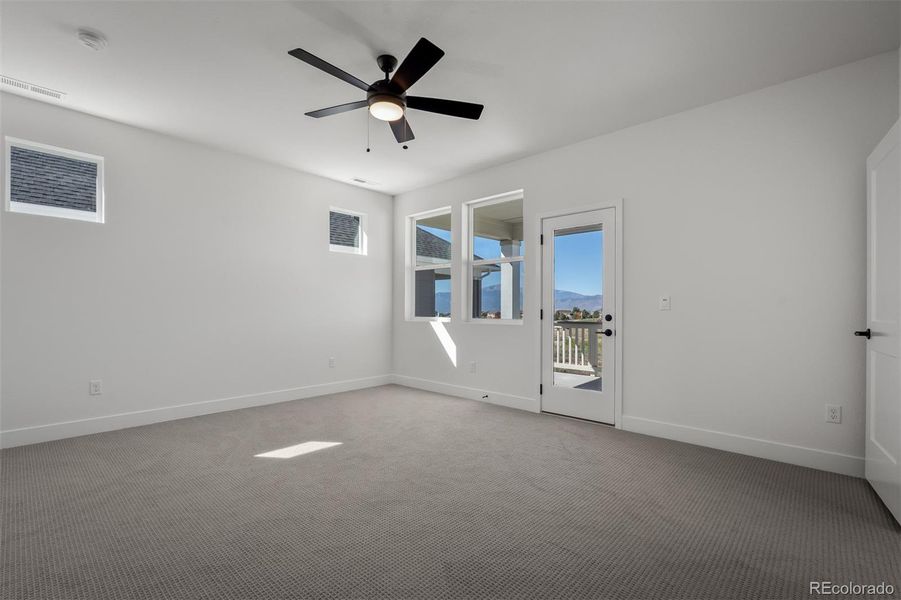 Spacious, unfurnished interior of a new home in Revel Crossing at Wolf Ranch - The Panorama Collection, Colorado Springs (Image 38).