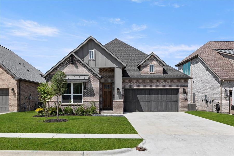 Front exterior of a new home in The Highlands, Rockwall, TX, highlighting curb appeal (Image 9).