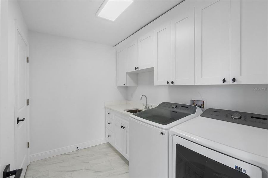 LAUNDRY AREA WITH NEW APPLIANCE WITH WASHER AND DRYER