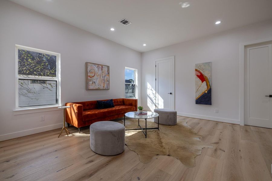 Secondary upstairs living perspective emphasizing the home’s versatile layout.