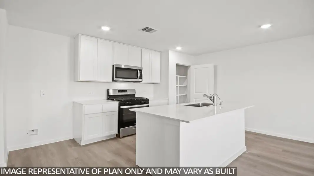 Furnished interior view inside a new home in Sunterra, Katy (Image 4).