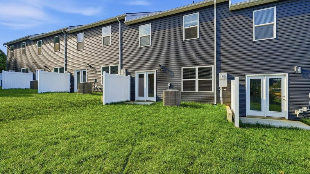Exterior details and patio area of a home in The Arbor Townhomes, Kingsport (Image 17).