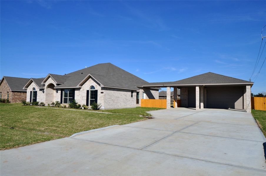 Front exterior of a new home in Pedregal, League City, TX, highlighting curb appeal (Image 24).
