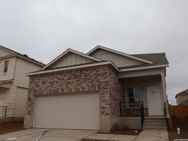 Front exterior of a new home in Park Place, New Braunfels, TX, highlighting curb appeal (Image 16).