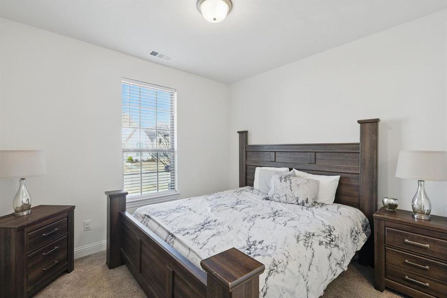 This bedroom has access to a private bath & walk-in closet. Perfect for Multigenerational Living