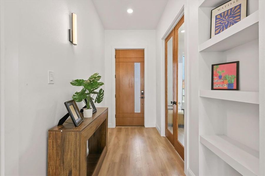 Entryway with wood finished floors and recessed lighting Entryway with wood finished floors and recessed lighting