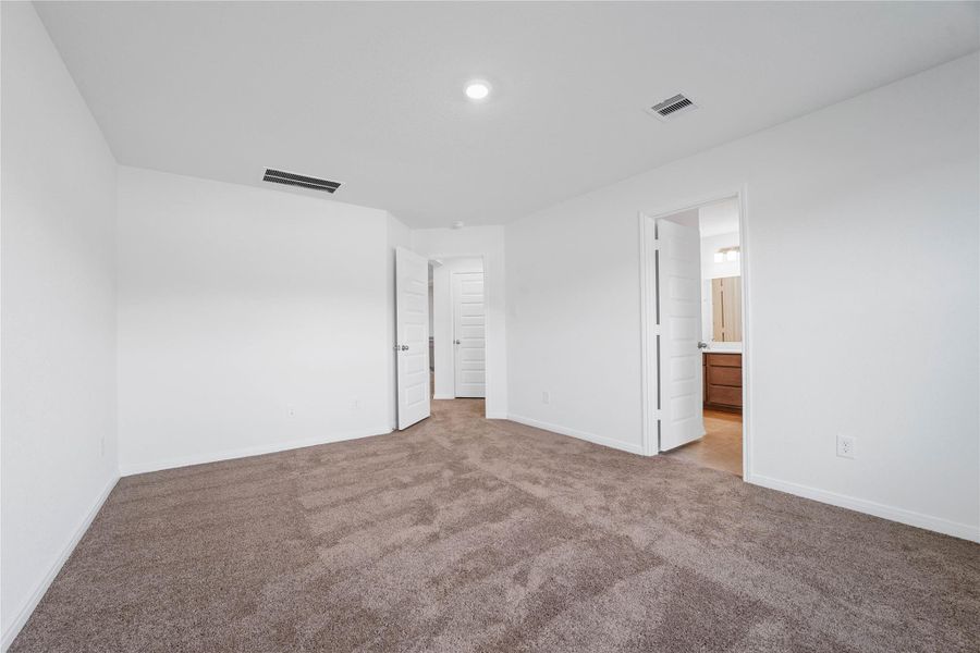Another perspective from the primary bedroom looking into the primary bathroom. Another perspective from the primary bedroom looking into the primary bathroom.