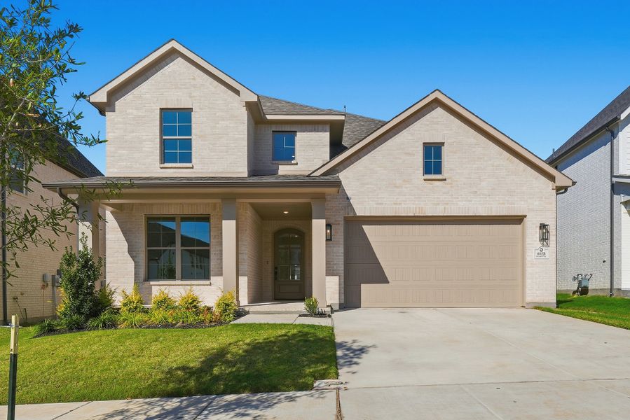 Front exterior of a new home in Tavolo Park, Fort Worth, TX, highlighting curb appeal (Image 1). Front exterior of a new home in Tavolo Park, Fort Worth, TX, highlighting curb appeal (Image 1).