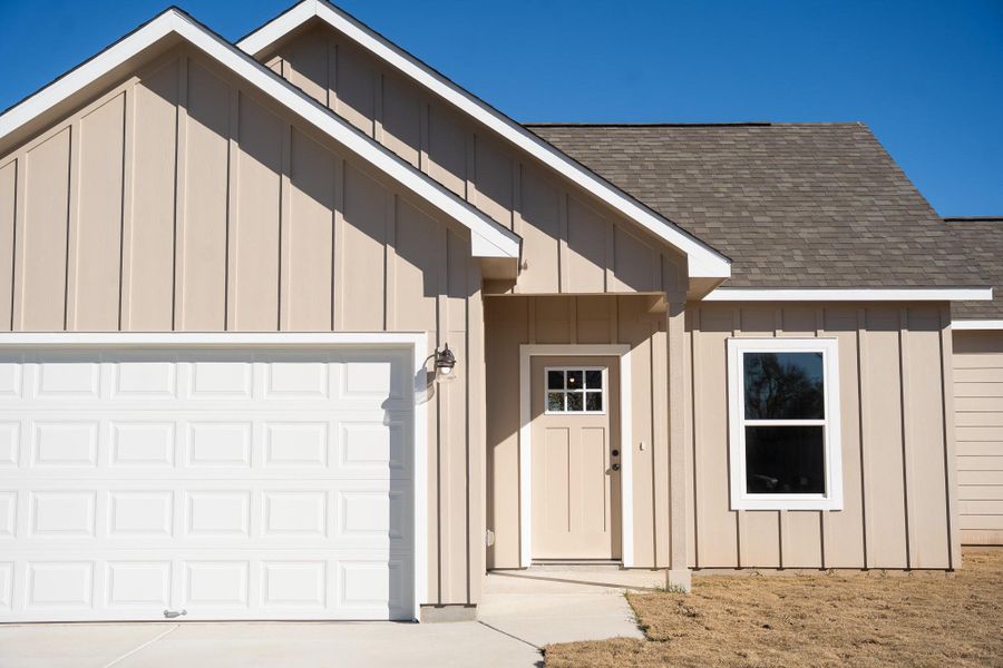 Front exterior of a new home in , Smithville, TX, highlighting curb appeal (Image 21). Front exterior of a new home in , Smithville, TX, highlighting curb appeal (Image 21).