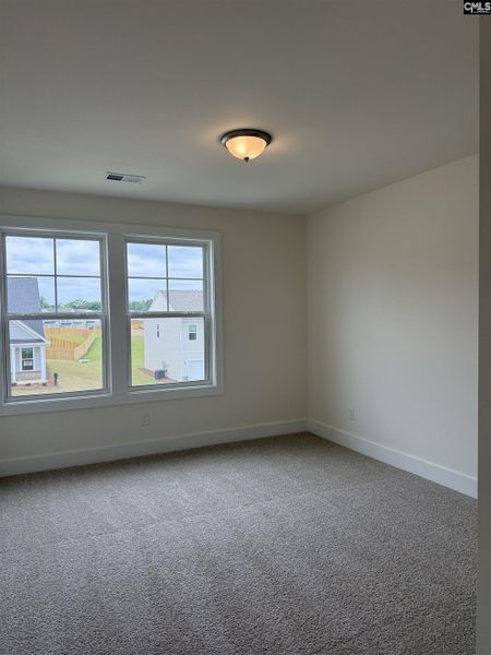 Spacious, unfurnished interior of a new home in Cottages at Roofs Pond, West Columbia (Image 44).