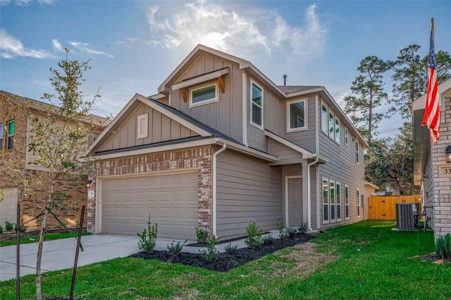 Front exterior of a new home in Woodland Lakes, Houston, TX, highlighting curb appeal (Image 25). Front exterior of a new home in Woodland Lakes, Houston, TX, highlighting curb appeal (Image 25).