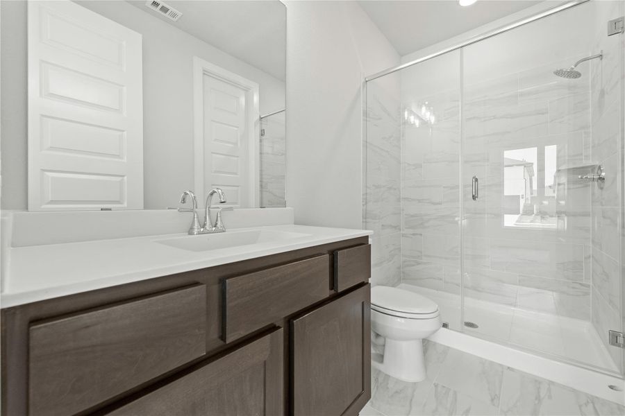 Furnished interior view inside a new home in Sunterra, Katy (Image 8).