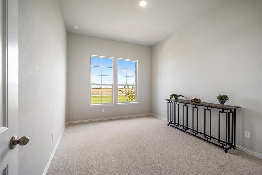 Unfurnished room featuring carpet floors and recessed lighting Unfurnished room featuring carpet floors and recessed lighting