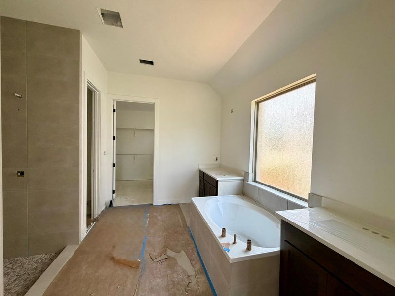 Primary Bath retreat with dual vanities, garden tub & walk-in shower Primary Bath retreat with dual vanities, garden tub & walk-in shower