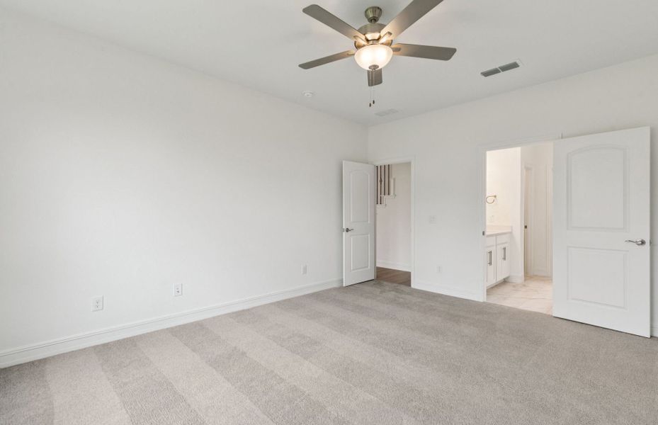 Elegant Owner's suite with beautiful finishes and ample floor space  *Real home pictured