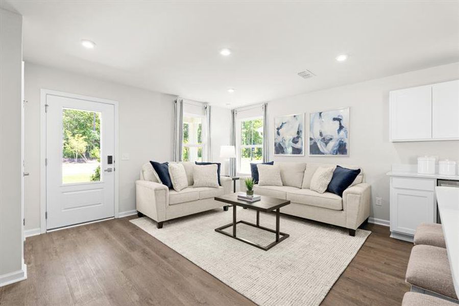Representative furnished interior of a home built from the Ellis by Ryan Homes in Middle Creek Village Coastal Cottages & Villas, Bolivia (Image 14).