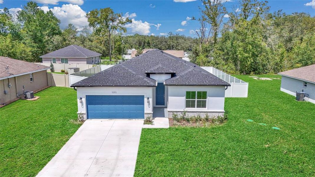 Front exterior of a new home in , Summerfield, FL, highlighting curb appeal (Image 18).