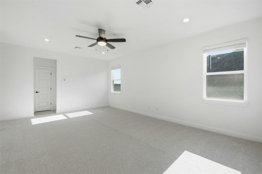 Unfurnished room with carpet, recessed lighting, and a ceiling fan
