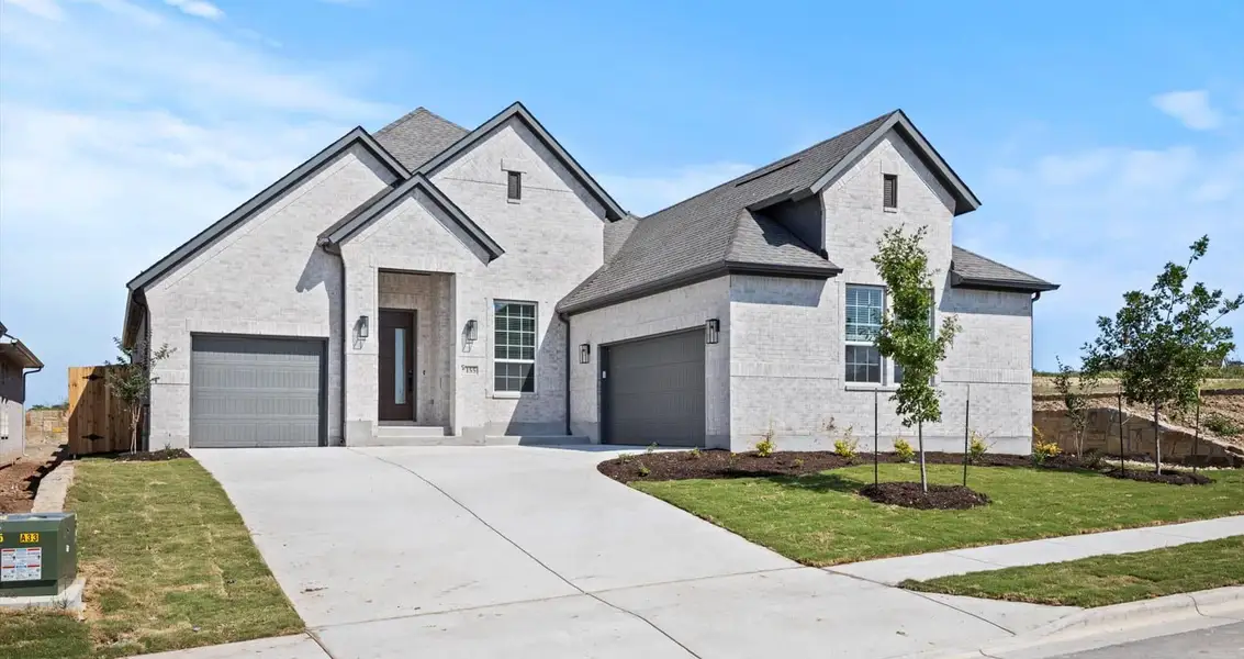 Representative exterior photo of a completed home built from the Farris by Chesmar Homes in 6 Creeks, Kyle, TX (Image 2).