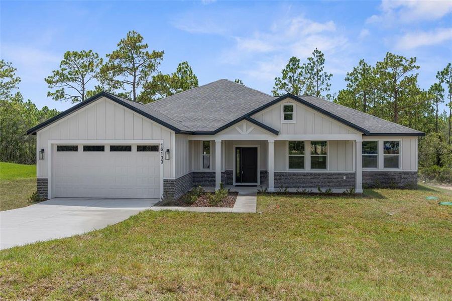 Front exterior of a new home in , Weeki Wachee, FL, highlighting curb appeal (Image 38).
