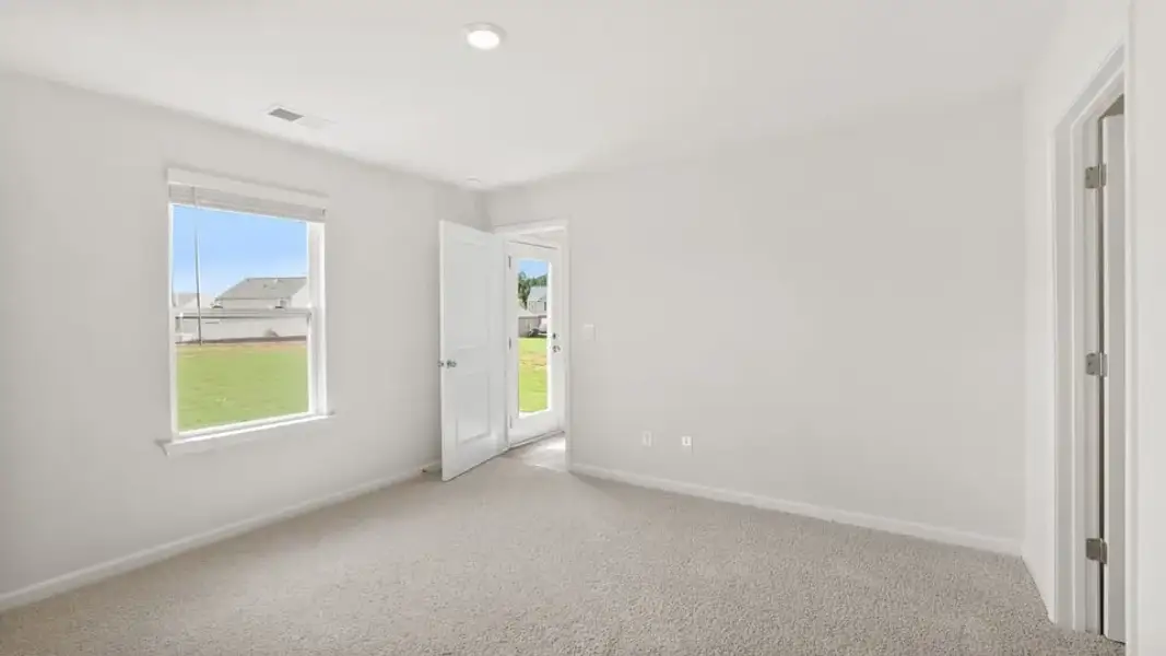 Spacious, unfurnished interior of a new home in Village Grove, Greenville (Image 30).