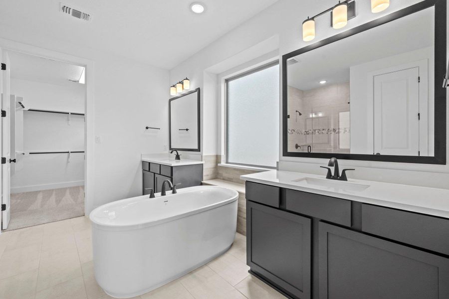 Primary Bath retreat with dual vanities & soaking tub