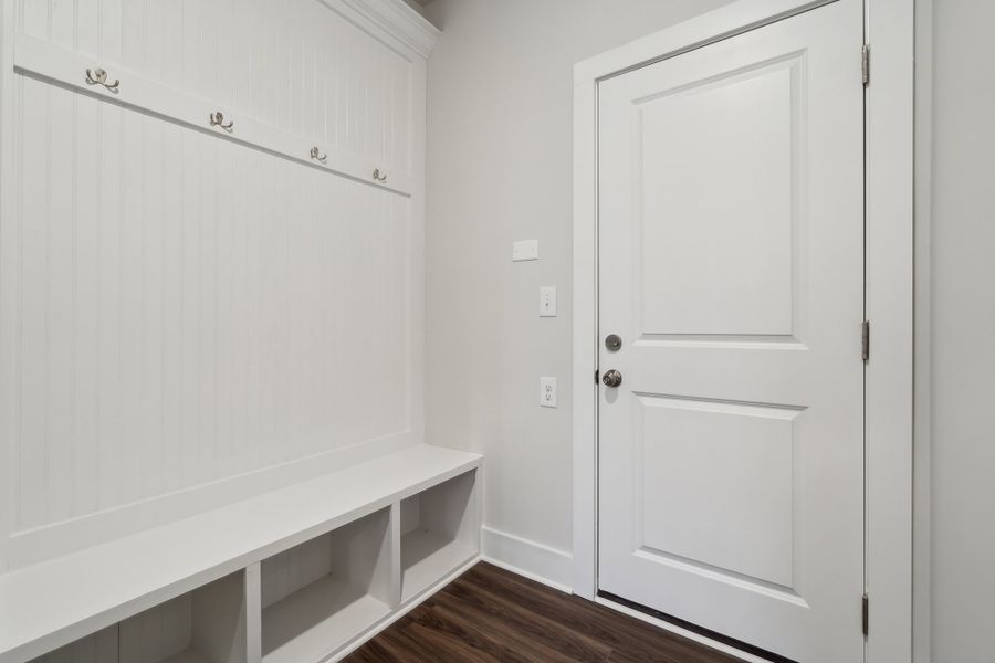 A white door in a room. A white door in a room.