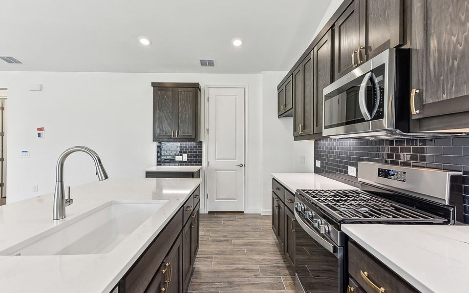 Furnished interior view inside a new home in Kissing Tree, San Marcos (Image 4).