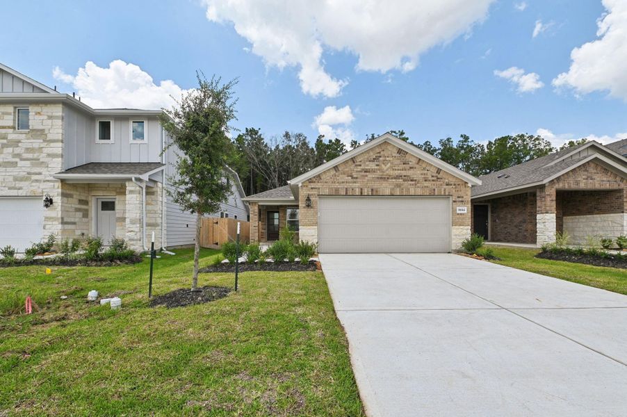Front exterior of a new home in , New Caney, TX, highlighting curb appeal (Image 1). Front exterior of a new home in , New Caney, TX, highlighting curb appeal (Image 1).
